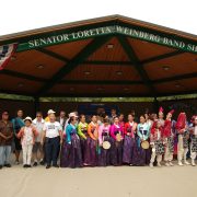 Performers, partners and community members gather for a group photo at the 7th Annual Peace Festival stage
