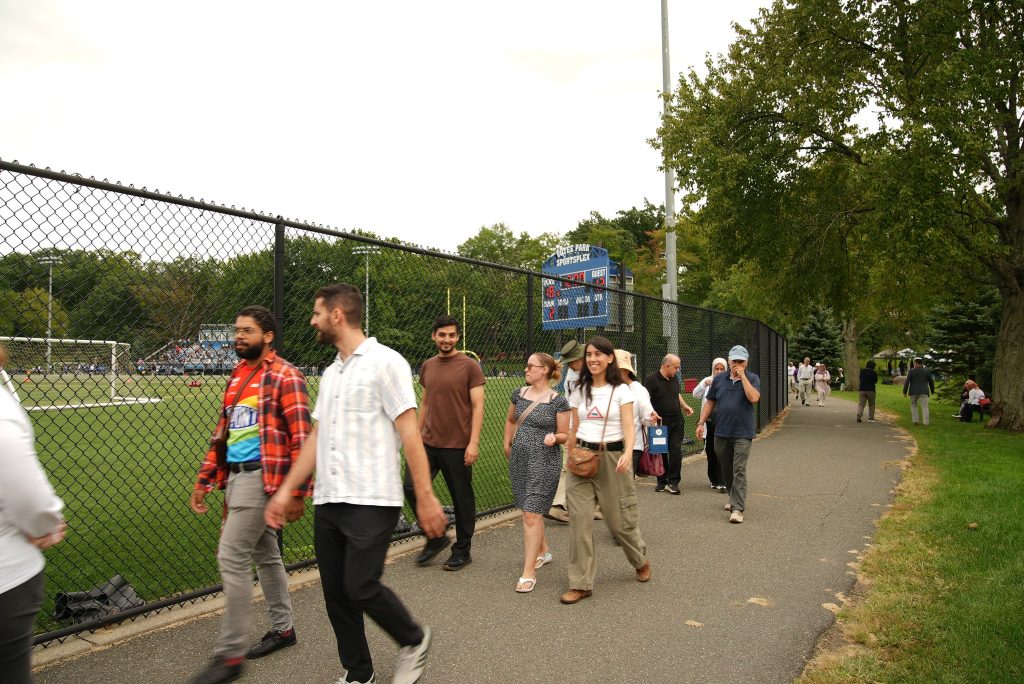 Participants walk along the park path during Bike & Walk for Peace