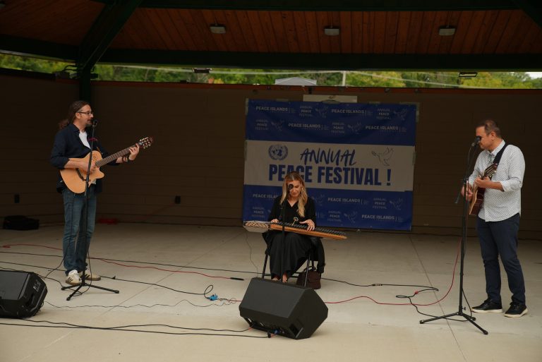 Musicians perform traditional music on stage